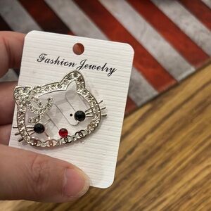 Silver Chanel Cat Brooch with Red and Black Accents